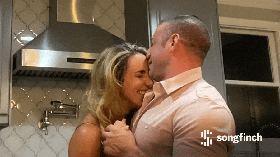 Couple celebrating and dancing to Songfinch song